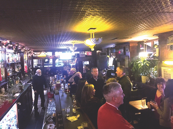 A crowd packs Peter McManus Café, which has been in business on Seventh Ave. since 1932. File photo by Dennis Lynch.